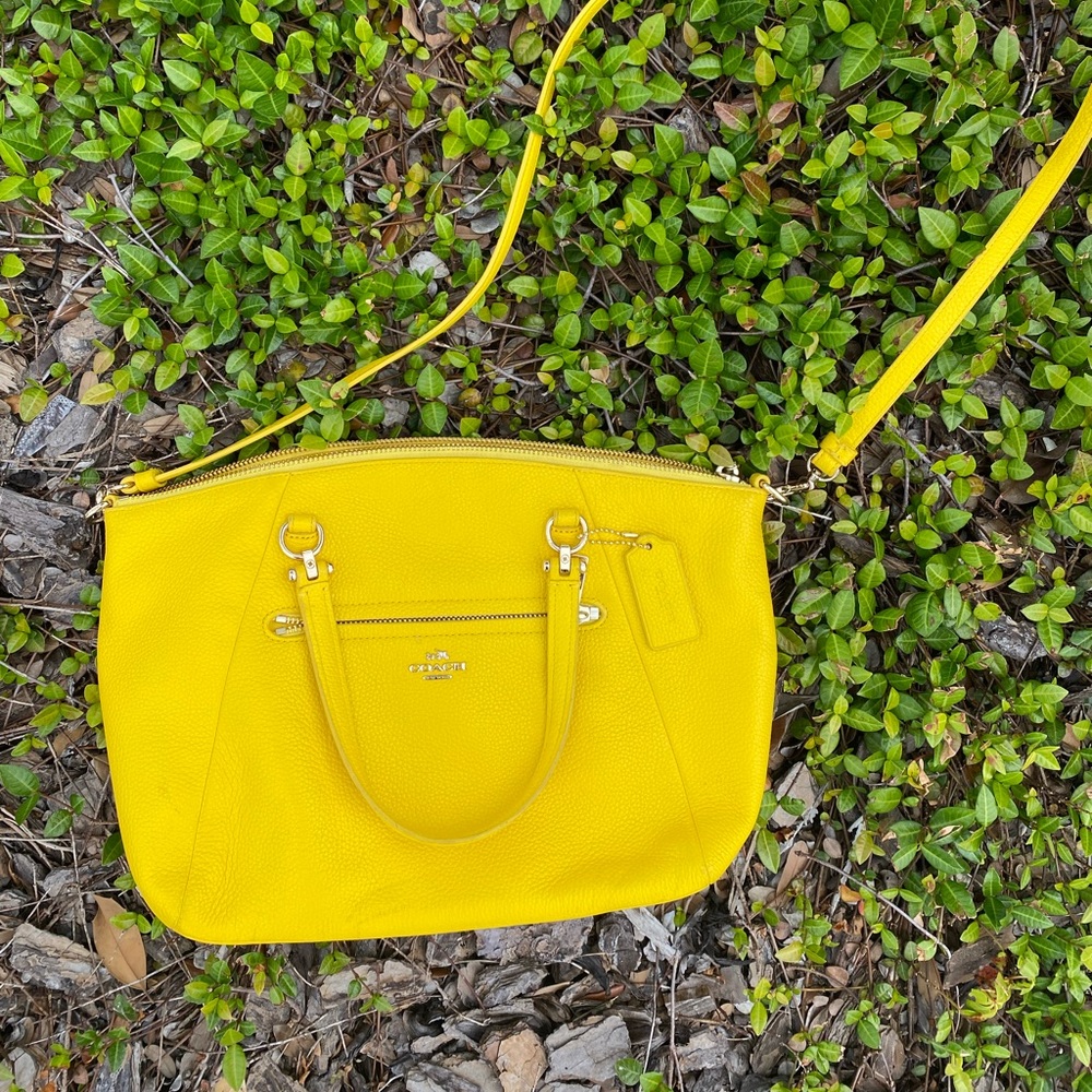 Yellow Coach purse with crossbody strap